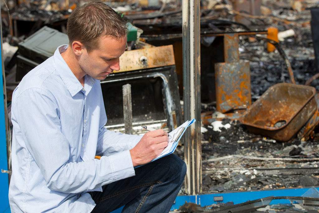 Man after a disaster Man filling out a form after a disaster Abbotts Fire and Flood Colorado