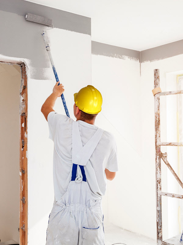 worker painting walls