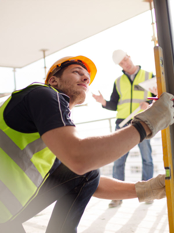 construction crew taking measurements