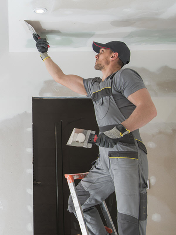Abbotts is finishing the drywall patch and paint on a completed water and fire damage restoration project in Aurora, Colorado